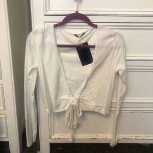 White long sleeve tee with an open tie front